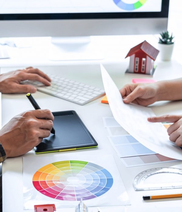 Team design of young Interior graphic designer working house pro Team design of young Interior graphic designer working house project sketching on graphic tablet and color swatch working at modern office, creative inspiration and imagine.